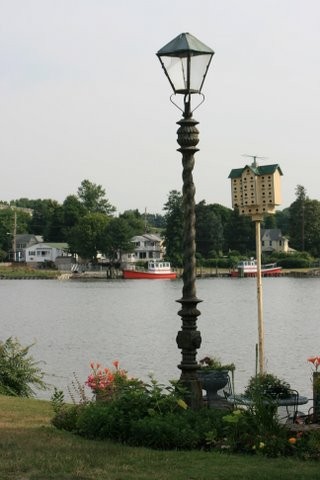 Decorative lampost and martin house along the canal